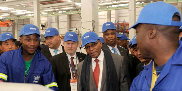 President Jacob Zuma and Trade and Industry Minister Rob Davies interact with workers during the official launch of the First Automotive Works (FAW) assembly plant in the Eastern Cape.