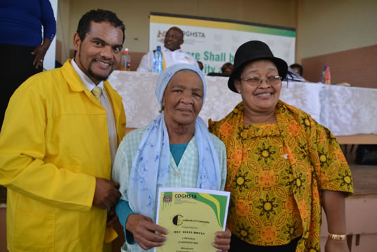 Premier of the Northern Cape Sylvia Lucas (right) and MEC for Cooperative Governance, Human Settlements and Traditional Affairs Alvin Botes with Mary Miles who received a house from the provincial government.