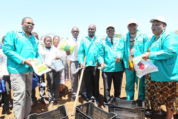 MEC Cyril Xaba hands over seeds and other equipment that the cooperative members will need to run their projects.