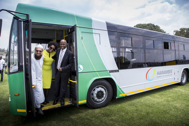 Gauteng MEC for Roads and Transport Ismal Vadi, seen here with Ekurhuleni Mayor Mondli Gungubele (far right), testing one of the Harambee buses.