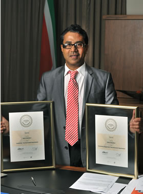 Director-General of Basic Education Bobby Soobrayan proudly displays the department's awards.