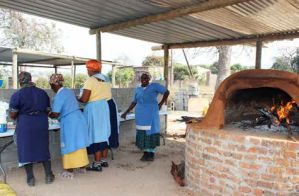 Women at the Vuka-uzenzele Project prepare dough at the Sehlulile Primary School in Matsulu outside Mbombela.