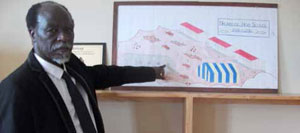 Principal Phiwayinkosi Ngubane points to a drawing of how Nkombose High School looked before the new school was built.