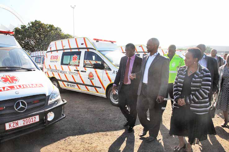 KZN Health MEC Dr Sibongiseni Dhlomo (centre) inspects the ambulances.
