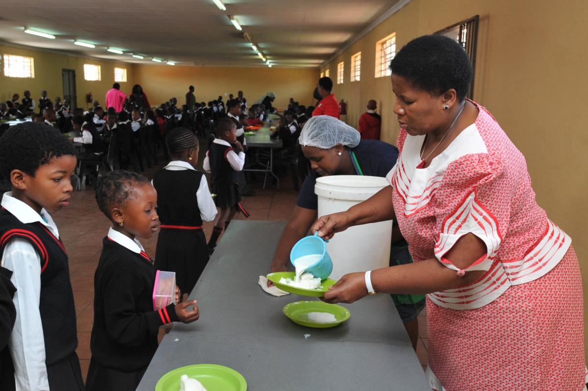 Mogobeng Primary School principal Mateta Marokoane serving lunch to some of the learners.