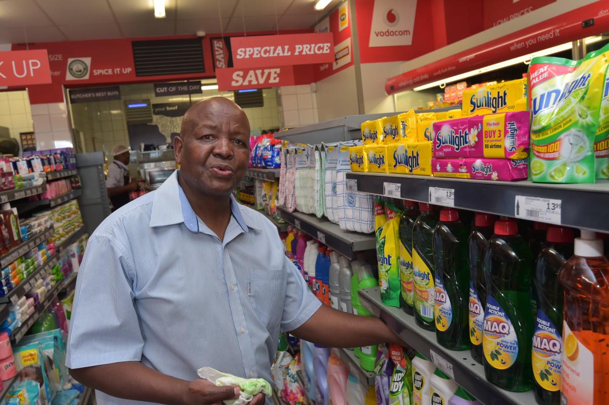 Solly Legae of Monageng Supermarket packing stock at his shop in Diepkloof. Monageng Market store has seen an increase in sales since becoming part of the pilot programme.