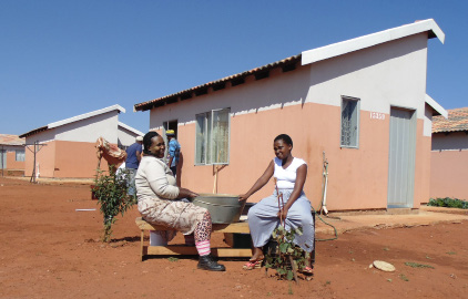 Beneficiary Funiwe Magudu together with her daugher Sanelisiwe Magudu outside their home in Mohlakeng, Randfontein.