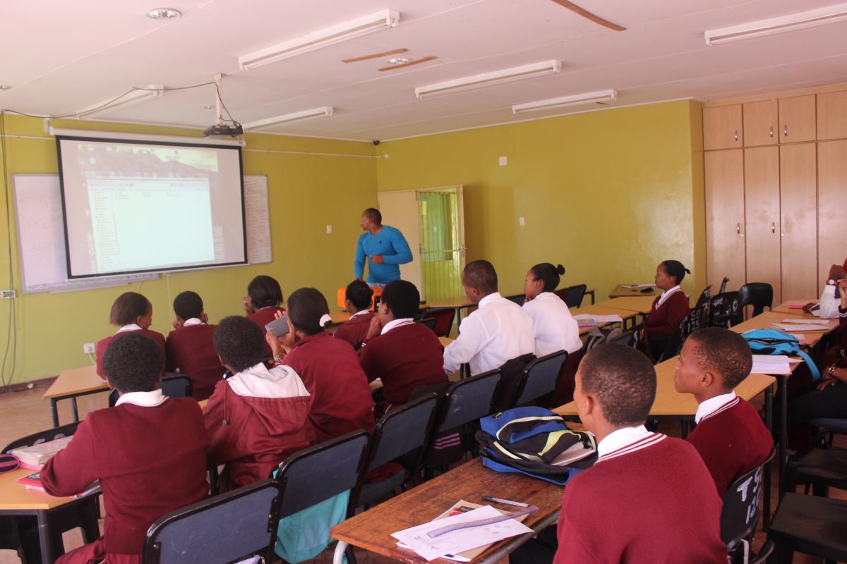 Learners at Tsoseletso Secondary School, Free State listen to English teacher Kamohelo Mongwenyane. The school now uses technology to teach lessons.