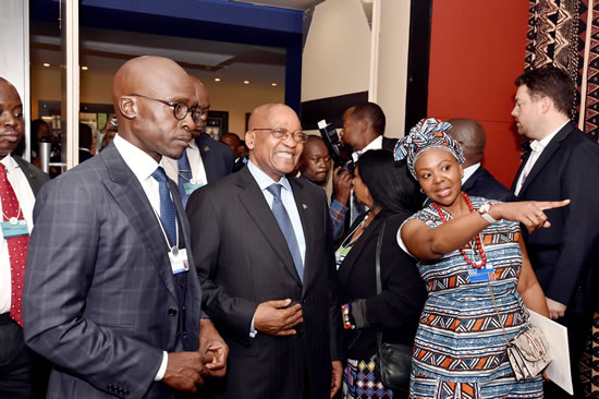 President Jacob Zuma accompanied by Minister of Finance Malusi Gigaba and head of WEF Elsie Kanza at the World Economic Forum on Africa meeting in Durban.