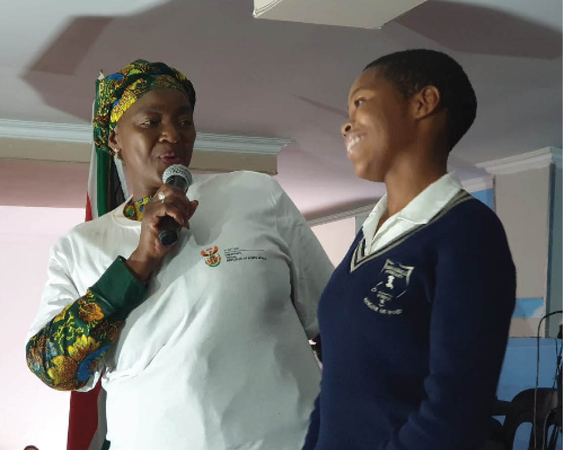 Minister of Women Bathabile Dlamini with one of the learners of Nkonkoni Primary School in Umlazi during the launch of the Sanitary Dignity Framework Programme.