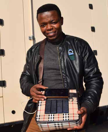 Tumelo Photolo with his first invention.