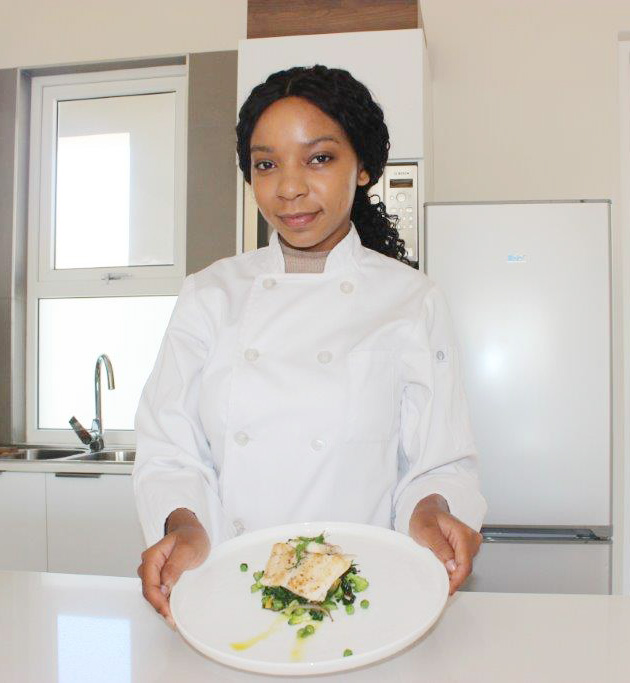 Chef Leigh-Ann Modise with her favourite vegetables and fish meal.