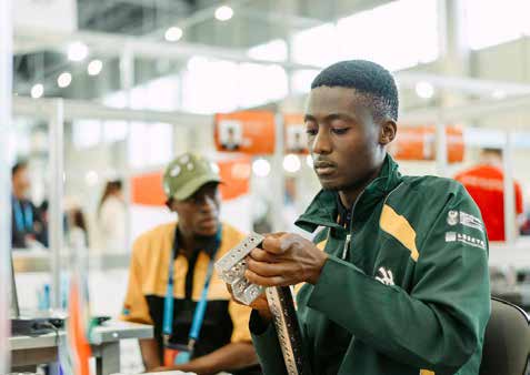 Tshwane University of Technology student Tebogo Moleha (in green jacket) during the WorldSkills Competition in Russia.