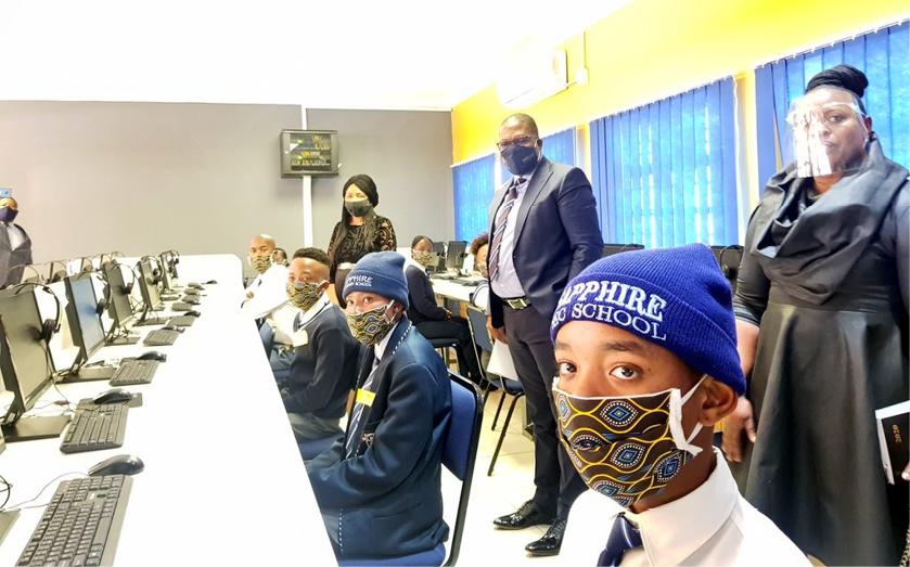 MEC Panyaza Lusufi with pupils from Rutasetjhaba Secondary School after government partnered with the SA MTN Foundation to ensure that schools impacted by the global pandemic have the technological tools they need.