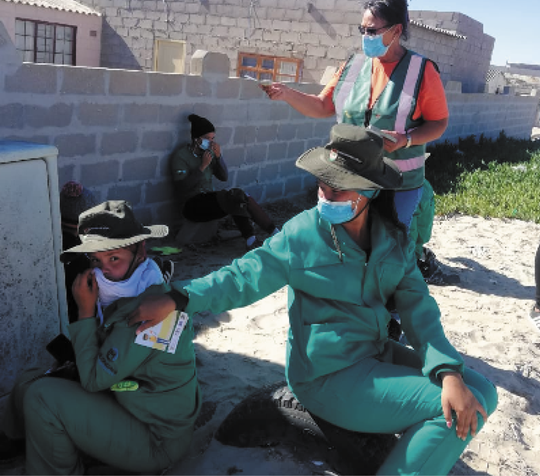 Hazel Meissenheimer (standing) conducting community awareness about the COVID-19 vaccine amongst Expanded Public Works Programme employees during a campaign in Port Nolloth.