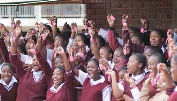 Delighted pupils showoff their Memeza personal alarms donated by the Memeza Women Empowerment Project.