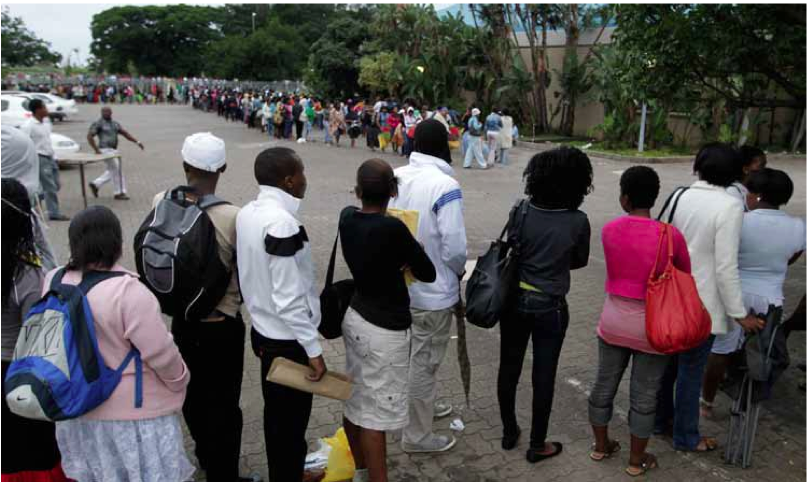 Photo caption: Students queue to apply for tertiary funding.