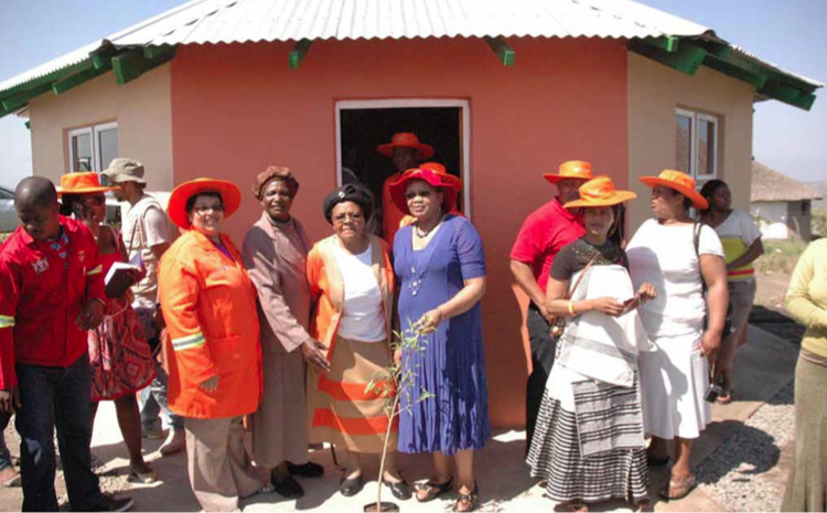 Photo caption: Eastern Cape MEC for Human Settlements, Safety and Liaison Helen Sauls-August hands over a new house in Kumanzi Village, Eastern Cape.
