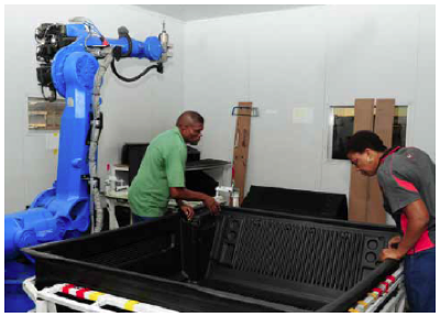 Photo caption: Employees of Babuthe Automotive Components work on bedliners for the new T6 Ranger, which are exported to Asia and Europe.
