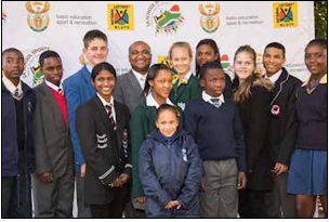 Sports and Recreation South Africa Director General Alec Moemi surrounded by the lucky young athletes who were awarded sports bursaries totalling R100 000 each