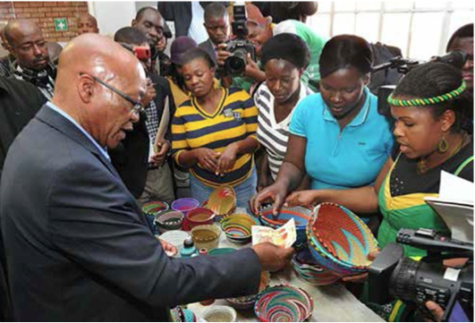 President Jacob Zuma went shopping in Muyexe, buying five large decorating bowls that Simango and her colleagues made out of straw.