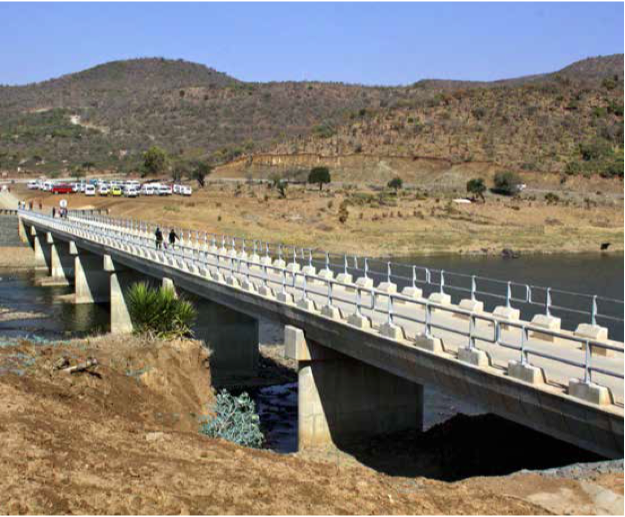 Positive changes: The new 135-metre Tugela River Bridge has stimulated economic activity, and improved access to education and health facilities between the villages of KwaNomoya and Sahlumbe in Ladysmith KwaZulu-Natal. (Inset) Safety first: Learners and community members are safe on the new bridge after years of risking crocodiles while crossing the river.