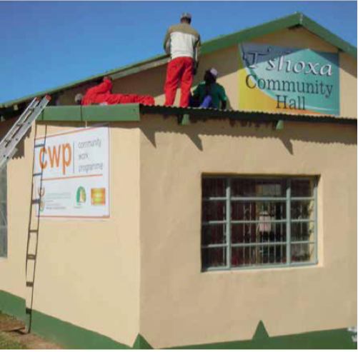 Community members install roofing during the upgrading of the hall in Keiskammahoek.