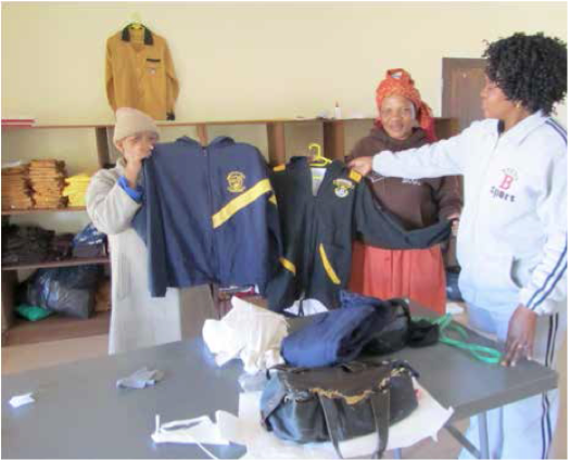 Photo caption: The women of Tshwaraganang Barolong display the school uniforms they have designed for the primary school in Motsiltane.