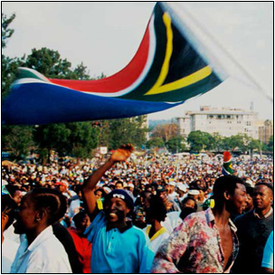South Africans celebrate the inauguration of South Africa’s first democratically elected President, the late Nelson Mandela in 1994.