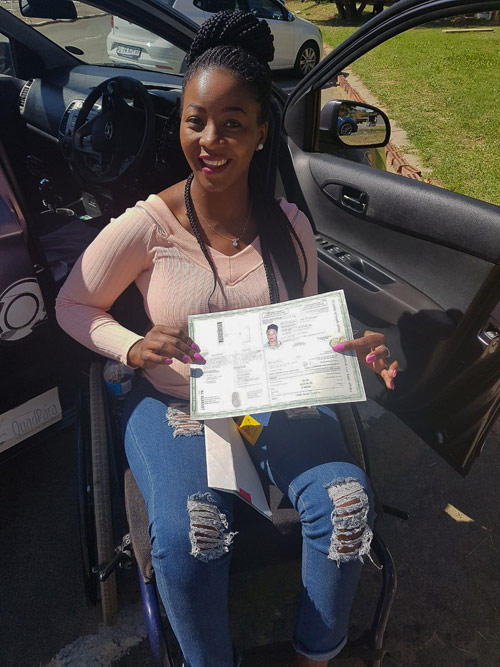 Carol Khoza is one of 80 people with a disability who got their driver's licence thanks to QASA's Driving Ambitions programme.