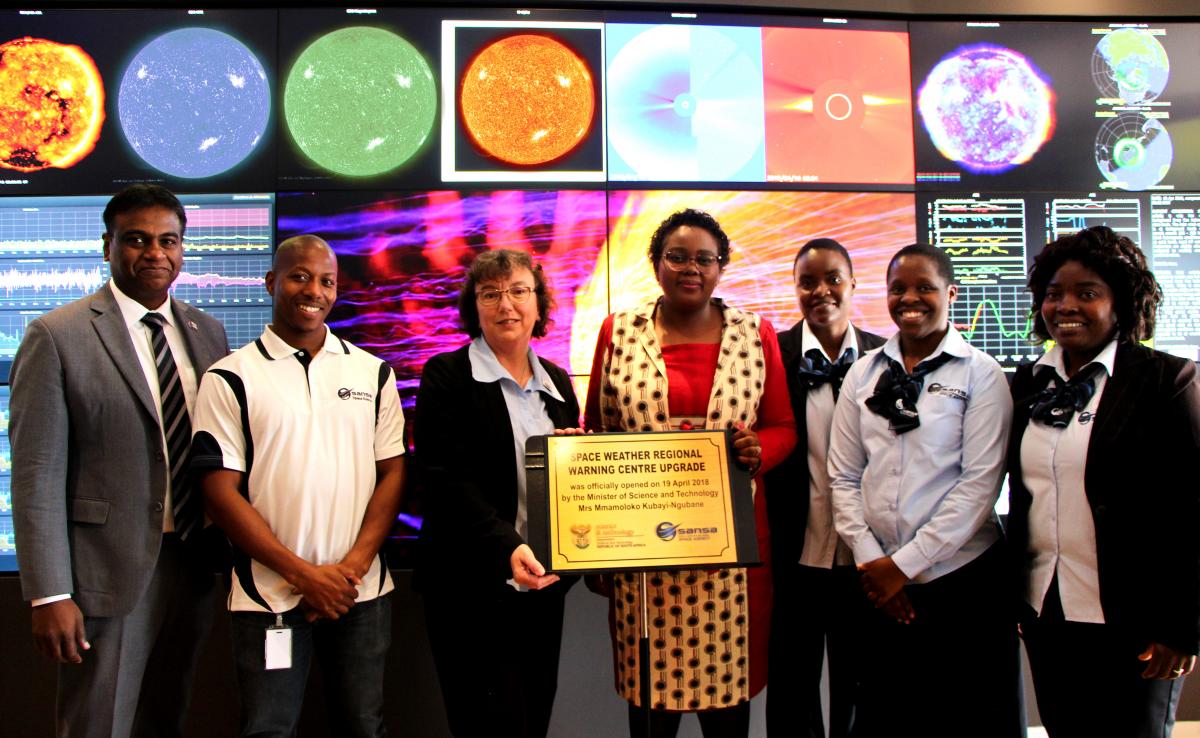 Minister of Science and Technology Mmamoloko Kubayi-Ngubane in the middle with the team who will be monitoring weather patterns in space at the upgraded Space Weather Regional Warning Centre in Hermanus.