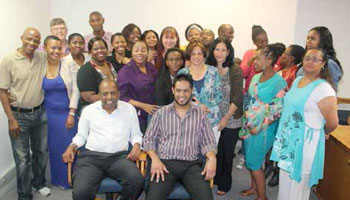 Municipal Manager Ted Pillay (front left) and Acting Manager : Finance, Riaaz Lorgat (front right) together with employees of the Sarah Baartman District Municipality.