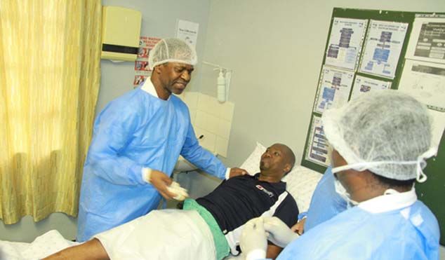 KwaZulu-Natal Health MEC Dr Sibongiseni Dhlomo with Melusi Yende the one millionth man to get circumcised.