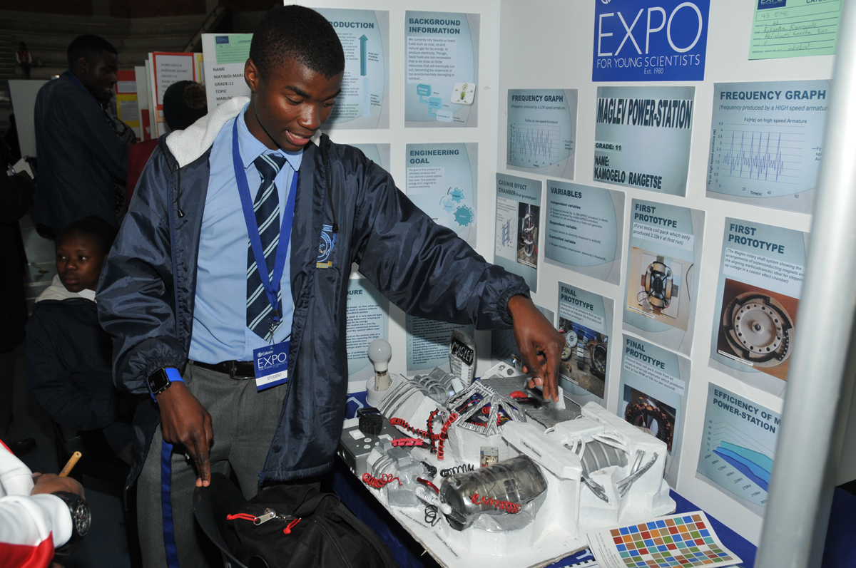 Kamogelo Rakgetse shows off his unique Maglev Power Station model.