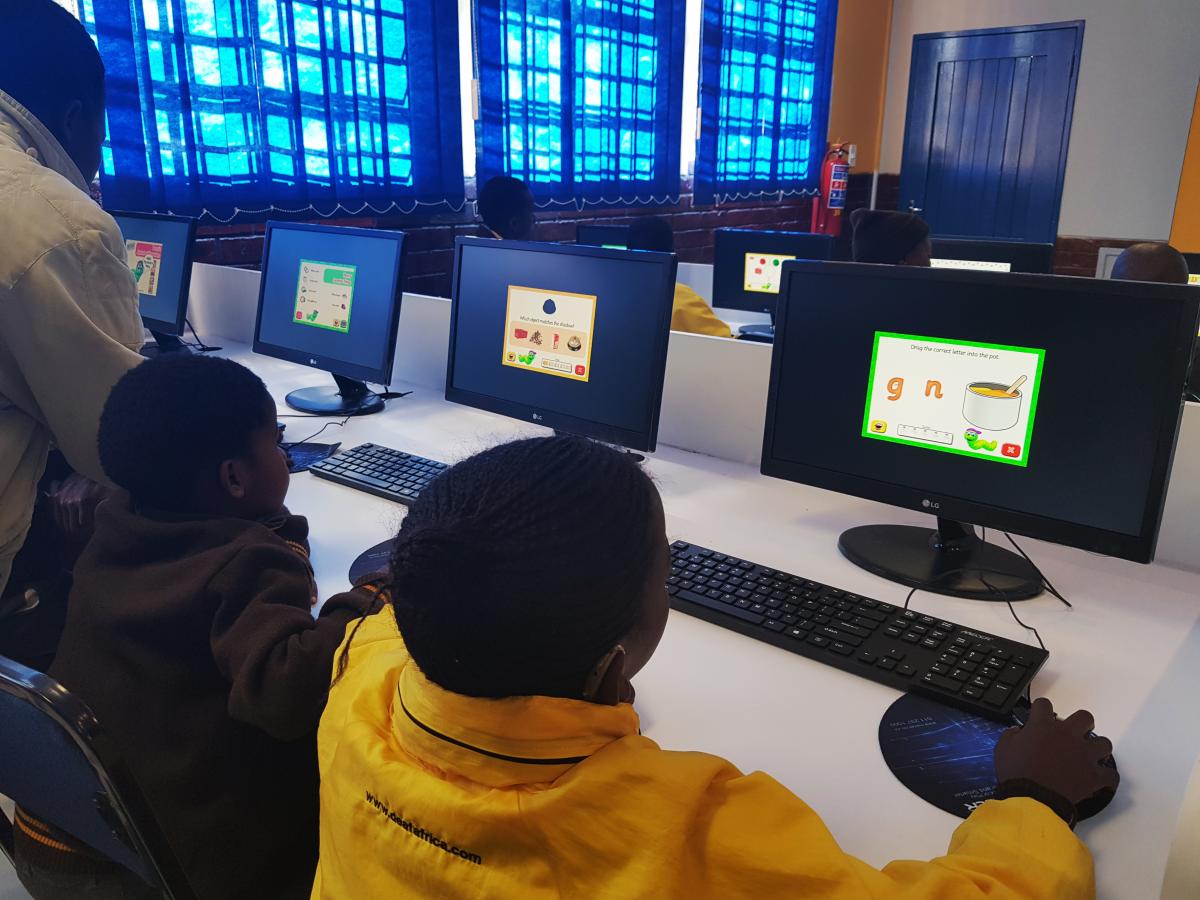 Learners at Sizwile School for the Deaf recieve the first computer lesson in the new computer laboratory.