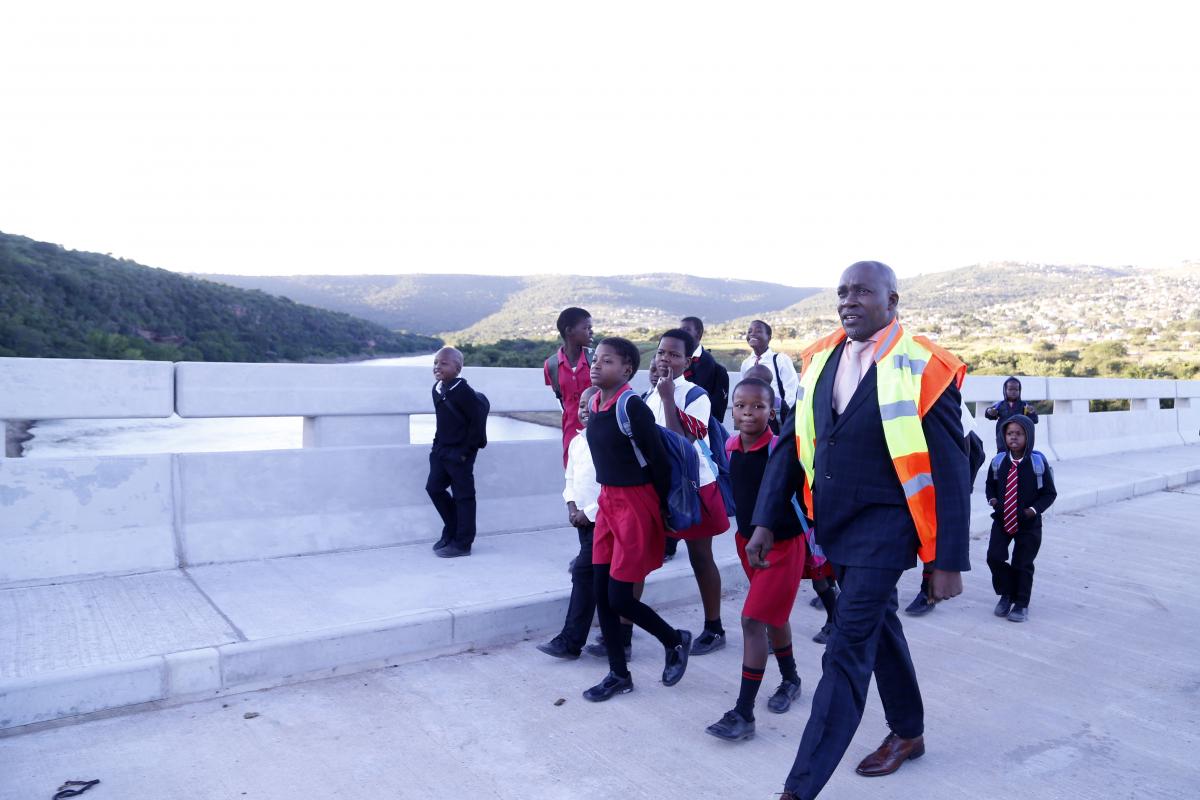 KZN MEC for Transport, Community Safety and Liaison Mxolisi Kaunda with local learners who now arrive on time for school.