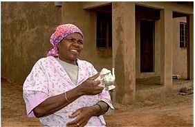 Tholakele Nxele in front of her house