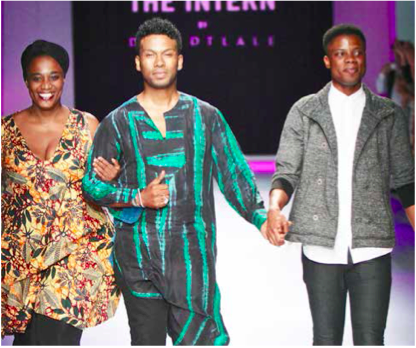 Young design interns Nokwanda Ngcobo (left) and Ayanda Mthembu (right) with David Tlale after showcasing their collections.