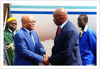 Zimbabwean Finance Minister Patrick Chinamasa welcomes President Jacob Zuma on arrival at the Victoria Falls International Airport.