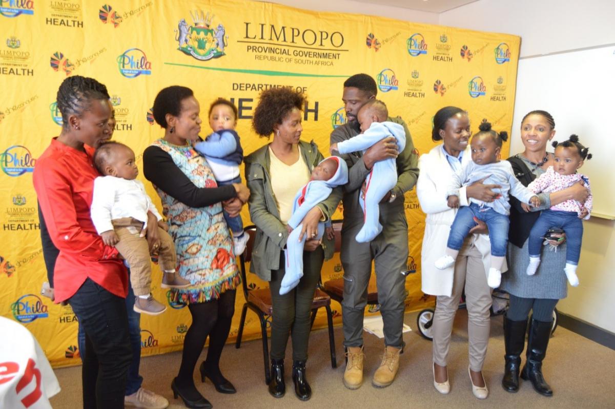 Limpopo Health MEC Dr Phophi Ramathuba flanked by breastfeeding mothers who came to the launch.