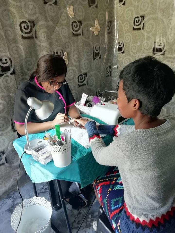 Businesswoman Thaini Masakane pampering one of many happy clients at her beauty spa.