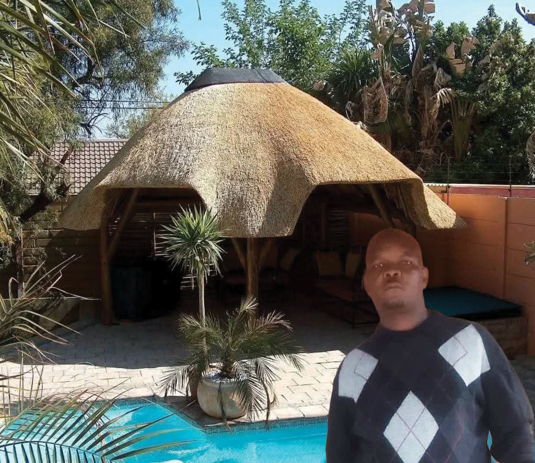 Andries Mgidi imparting knowledge to young people through his roof thatching skill.