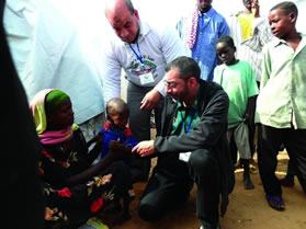 Mr Imtiaz Sooliman lending a helping hand to victims in Somalia.