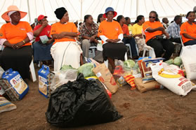 Beneficiaries of the Food for Waste Programme receiving food parcels which will go a long towards feeding their families.