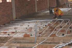 Laying cables for the underfloor heating.