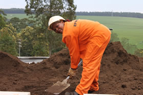 An EPWP beneficiary prepares the roof garden of the “green” building.