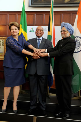 Brazilian President Dilma Rousseff; President Jacob Zuma and Indian Prime Minister Monmohan Gupta join hands at a press confernce during the IBSA Summit held at the Presidential Guest House in Pretoria in October.