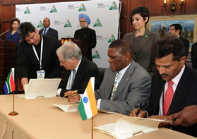 At the back from left are President Dilma Rouseff, President Jacob Zuma and Prime Minister Manmohan Singh observing as Brazilian Amassador Pedro Luis Carueiro de Meudenca, South African Ambassador Sisa Ngombane and Indian Ambassador Virenda Gupta sign agreements during an IBSA meeting. 
