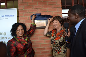 Gauteng Premier Nomvula Mokonyane and Mec Barbara Creecy unveil the plaque at Itirele Zenzele SecondarySchool in Diepsloot which opened its doors for the first time at the start of the 2012 school year. The school also boasts brand new sporting facilities.