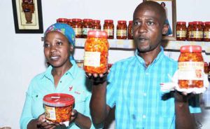 Businessman Tshepho Makwela and his wife Elizabeth display the atchar that he supplies to stores and exhibits across the world.